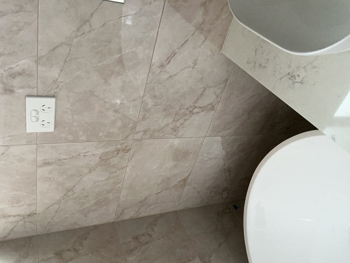 Light or switch too close to a bath, recorded during a handover inspection in Austral