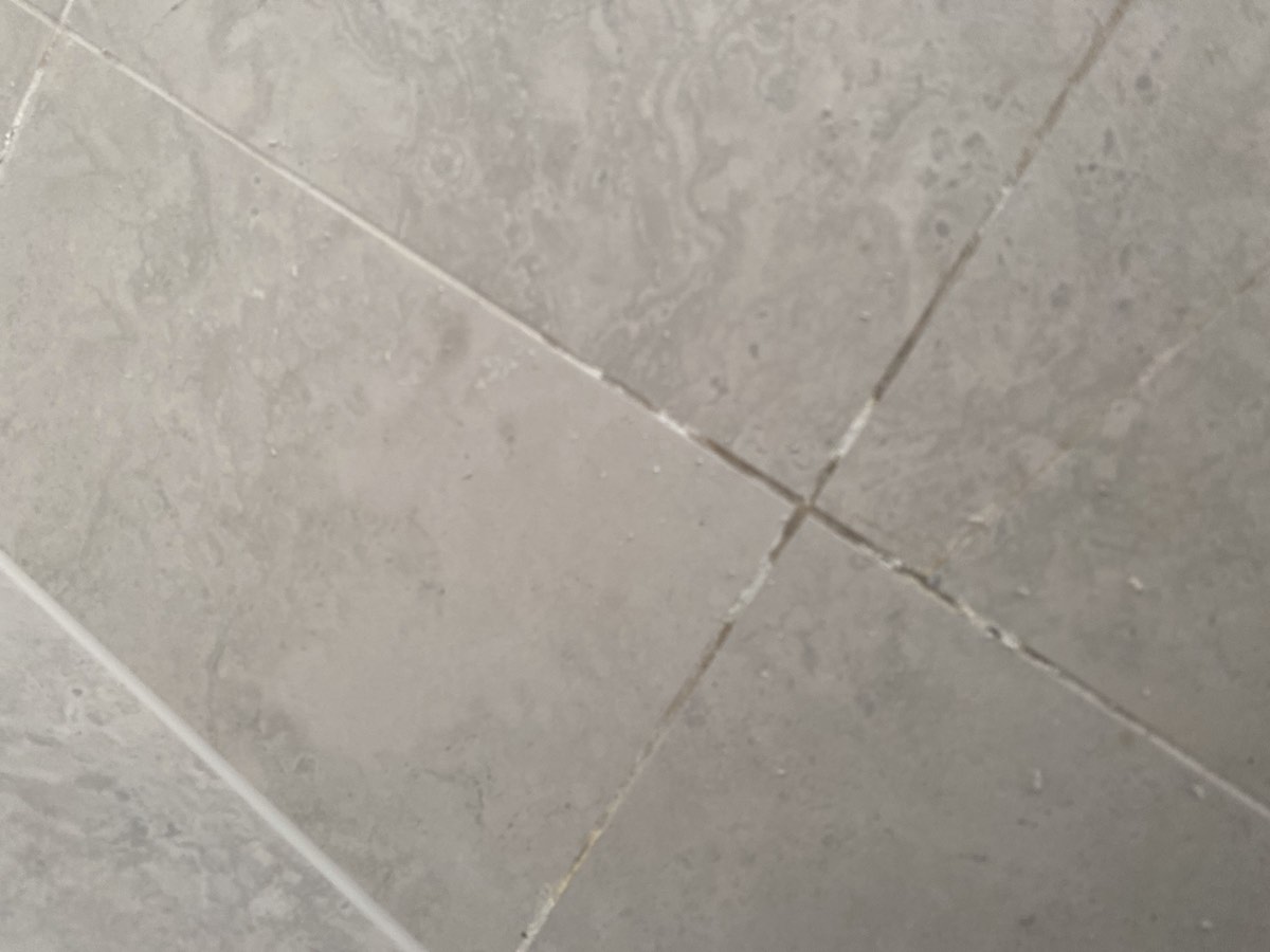 Efflorescence to tiling, recorded on a handover inspection in Austral